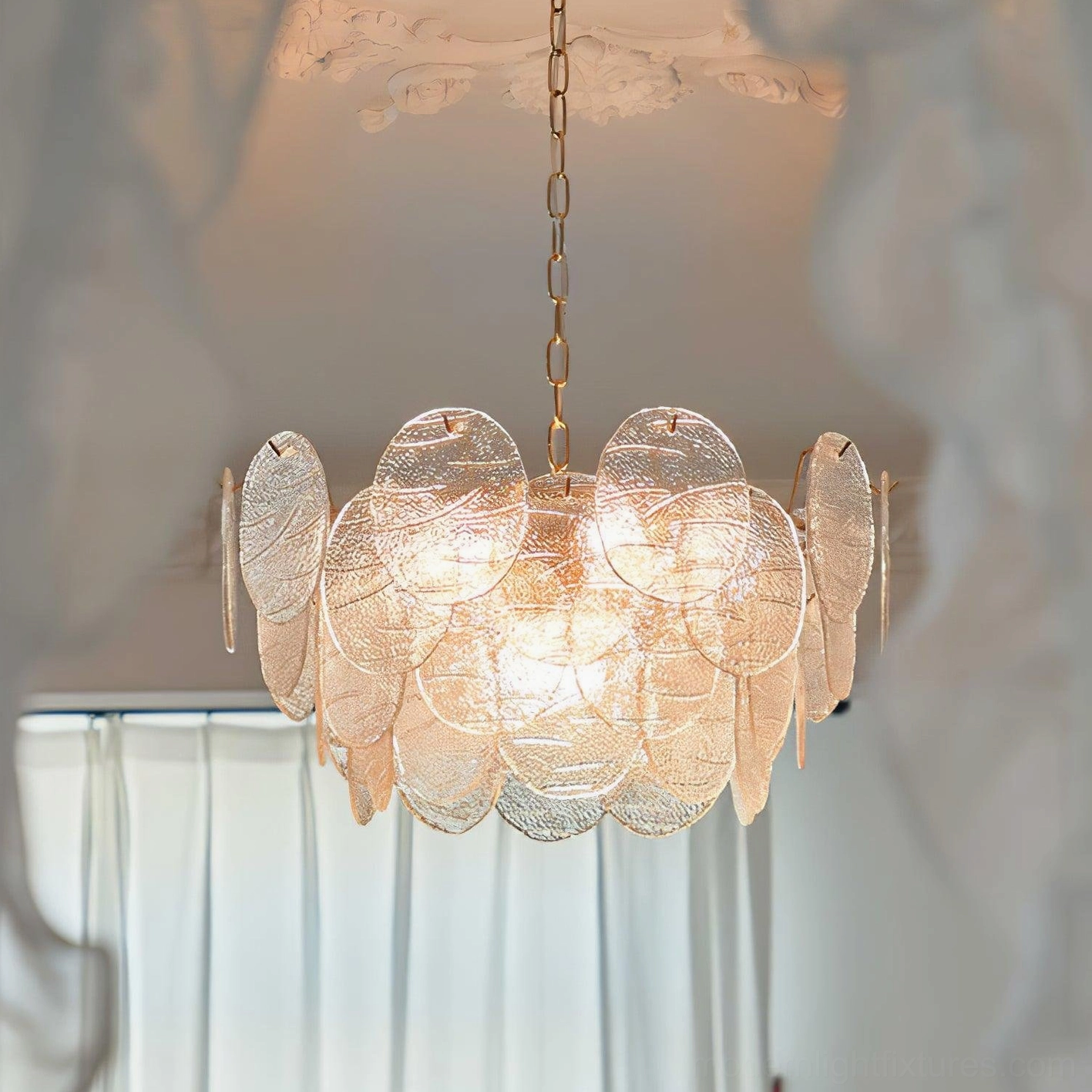 Close-up detail of disc Victorian chandelier brass gold hardware and glass panel construction