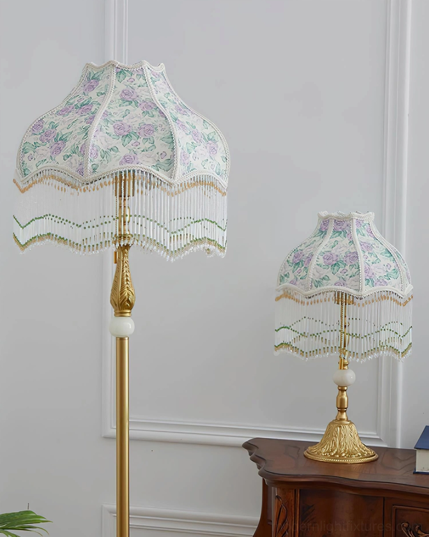 Victorian floor lamp and matching table lamp set with floral shades in white paneled room