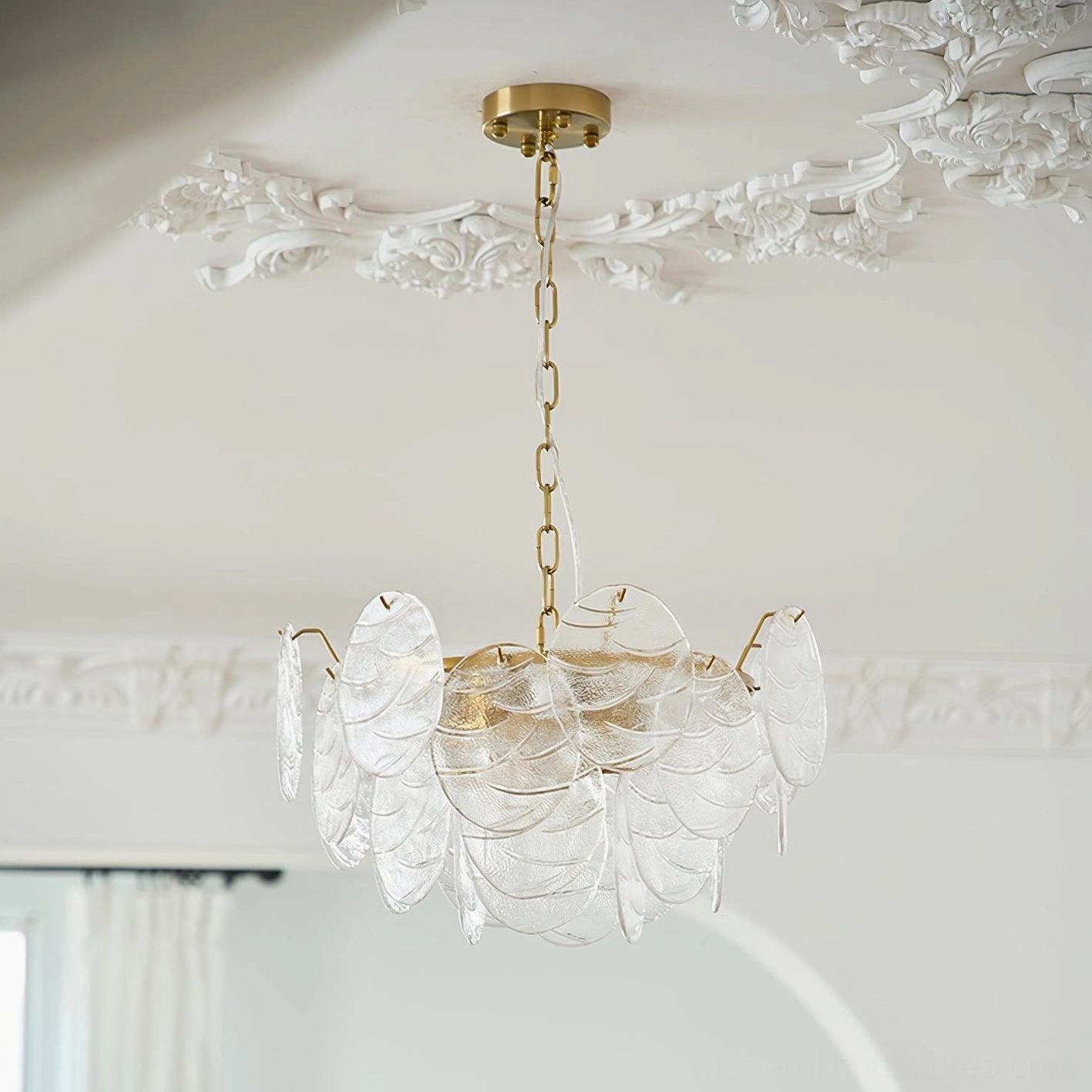 Vintage style glass disc chandelier installed in European retro room with decorative ceiling trim