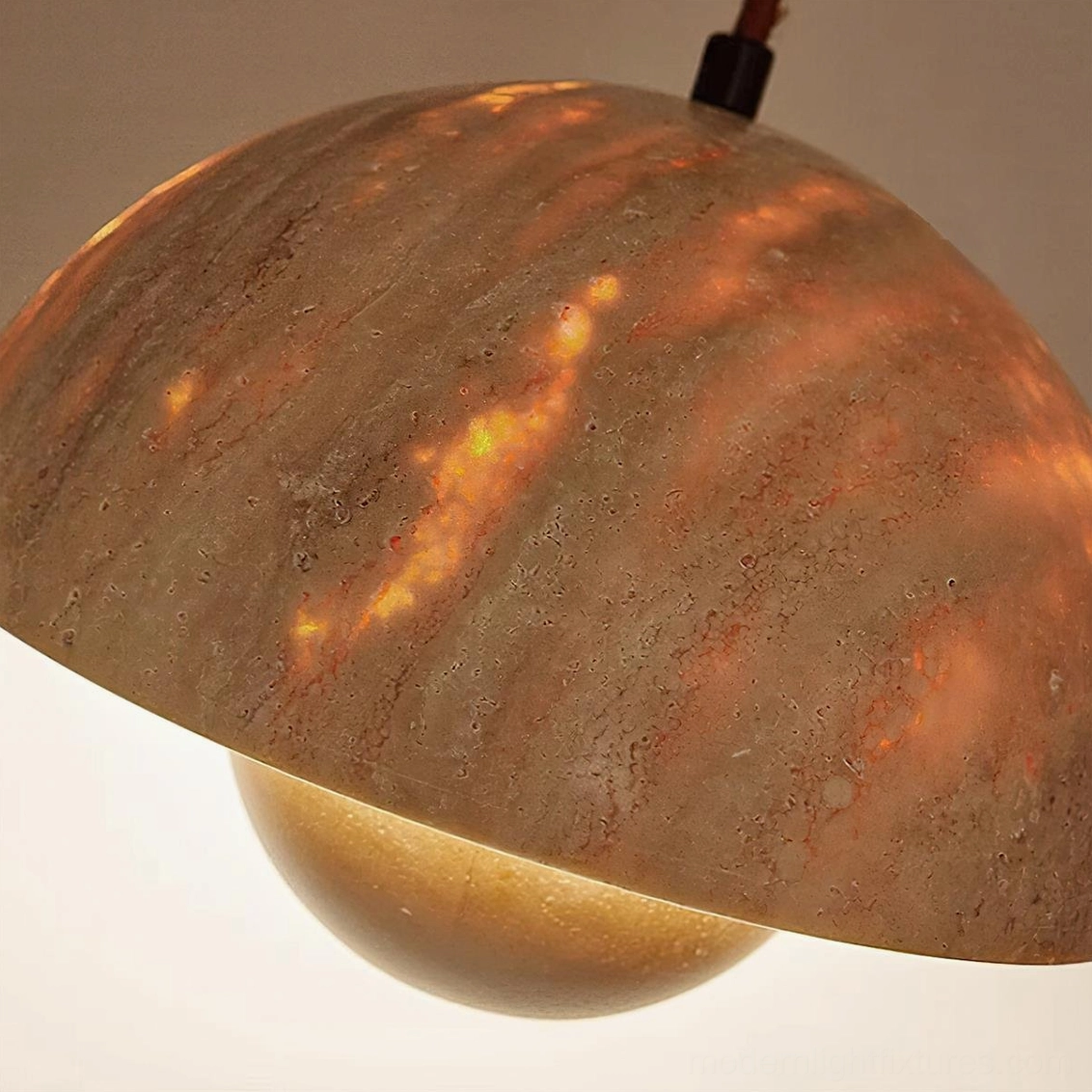 Vienna travertine dome pendant showing warm LED integration and premium hardwired installation compatibility