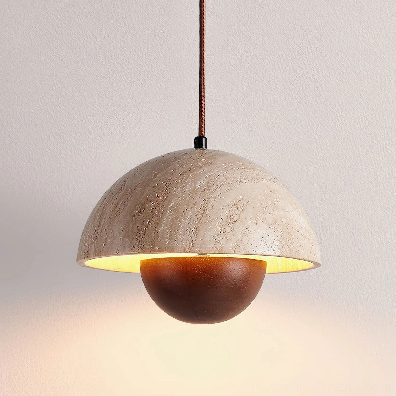 Close-up detail of Vienna pendant light showing travertine stone dome surface with warm LED glow interior
