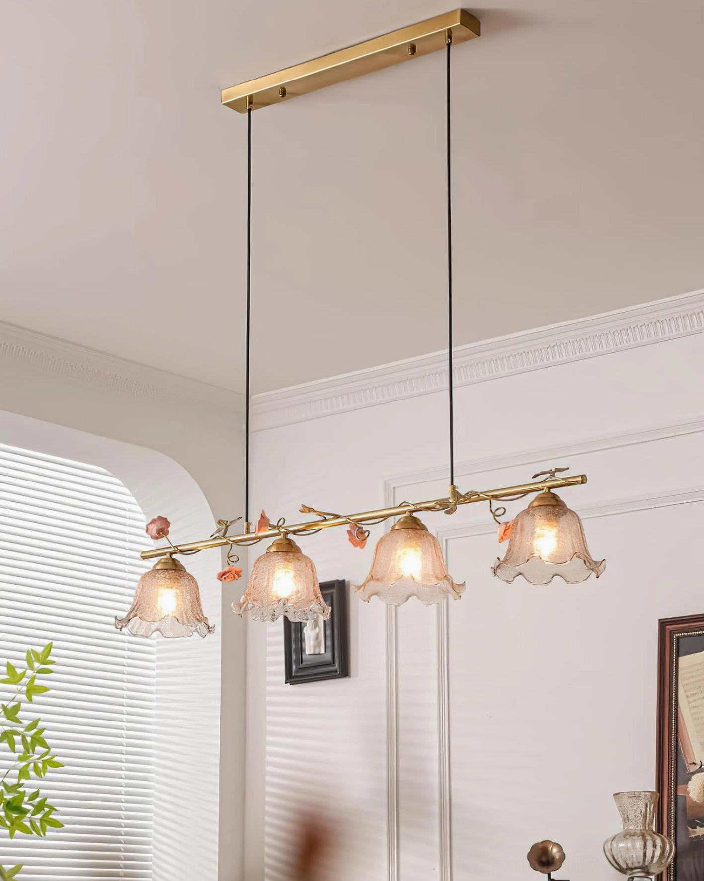 4-light floral linear pendant with antique brass frame and smoked glass bell shades, botanical accents