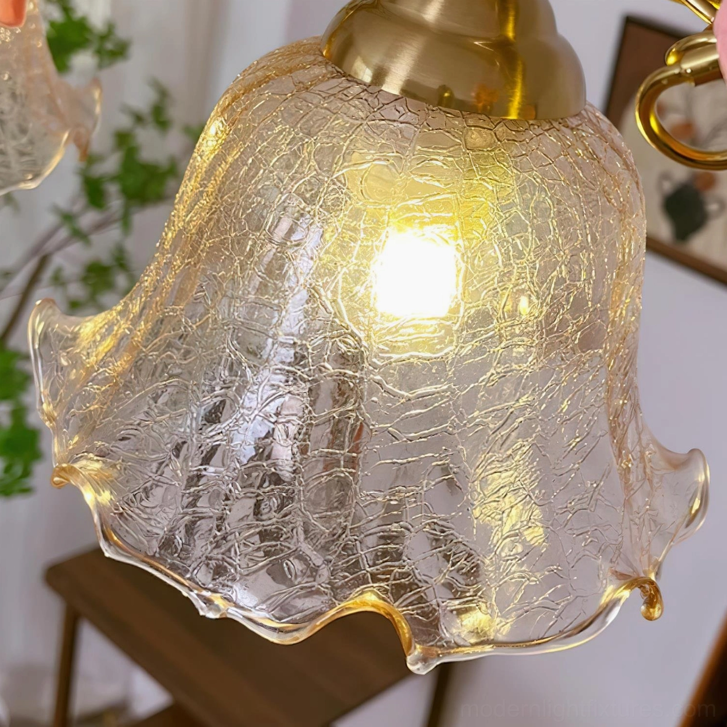 Floral brass linear chandelier with hand-formed glass shades and ceramic flower details, kitchen lighting