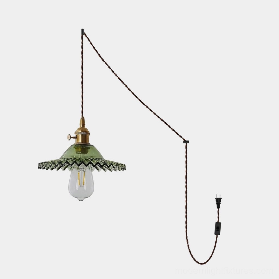 Vines plug-in pendant light with gold vine frame and green fluted glass shade, front studio view