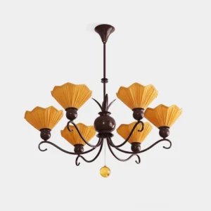 8-light vintage pleated fabric chandelier with chocolate scrollwork frame, amber shades and hanging glass ball, studio product shot