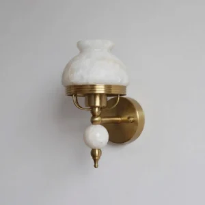 Alabaster dome wall sconce with aged brass finish, three-quarter side view showing sculptural form