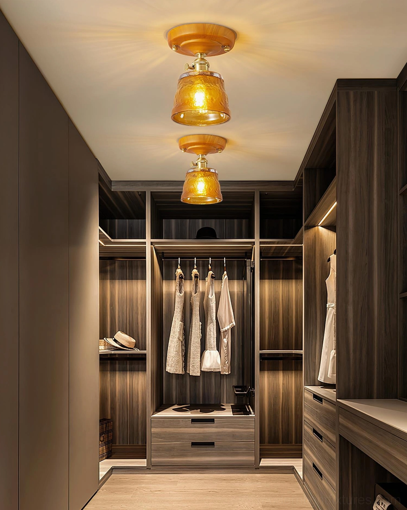 Pair of vintage amber glass ceiling lights installed in walk-in closet with warm ambient lighting