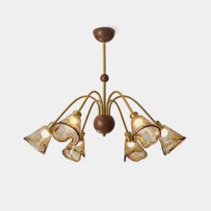 Vintage amber glass chandelier with curved brass metal arms and ruffled amber glass shades - front view on white background