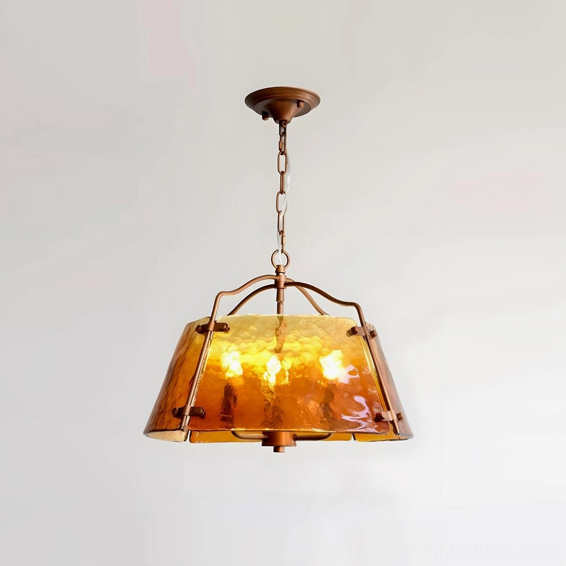 Four-bulb vintage amber glass pendant chandelier with brown metal frame, front studio view