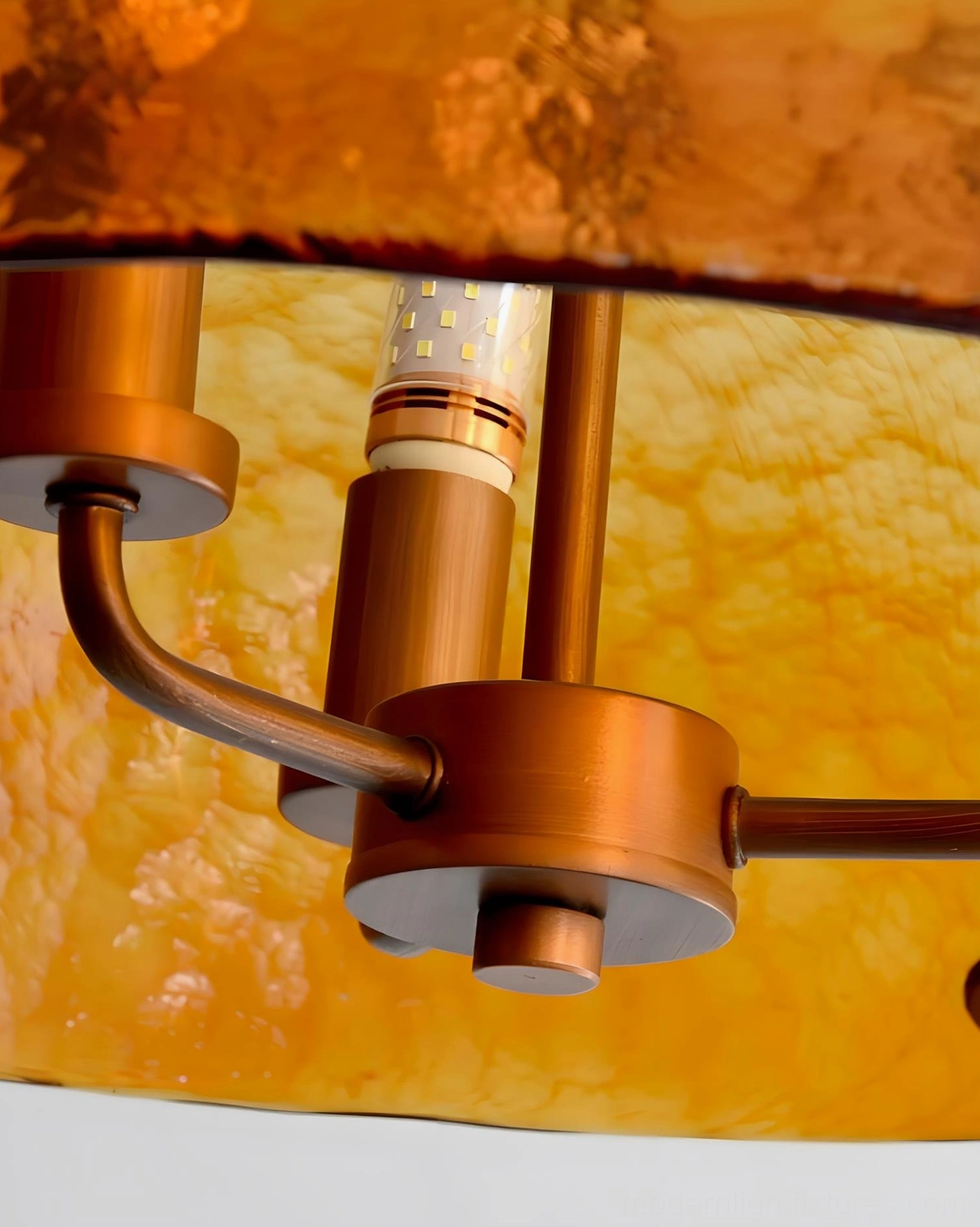 Vintage amber glass pendant chandelier under-view showing antique copper canopy and suspension system