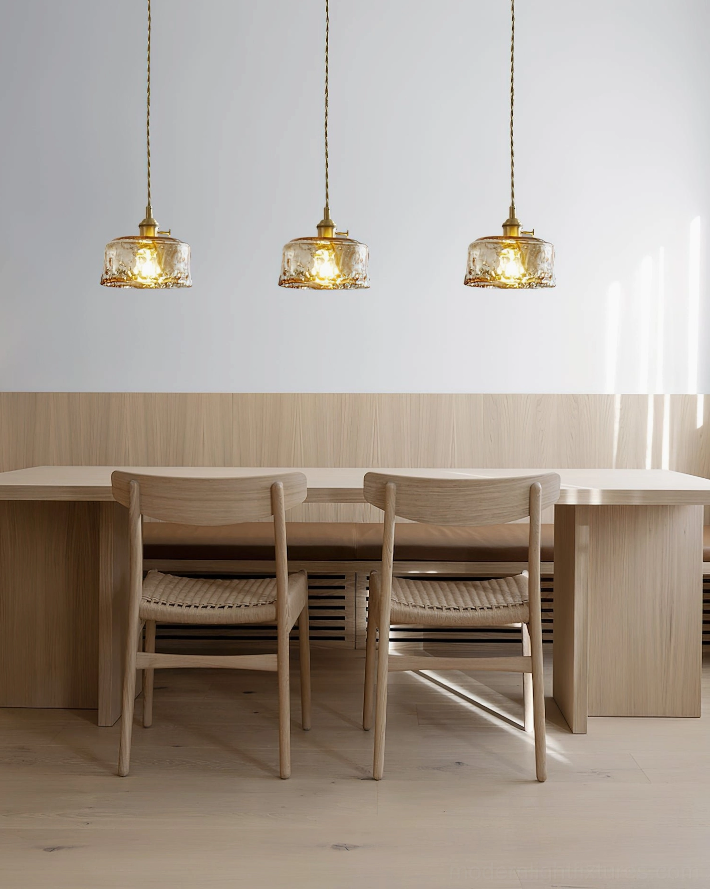 Set of three vintage amber pendant lights over modern dining table - Japandi design