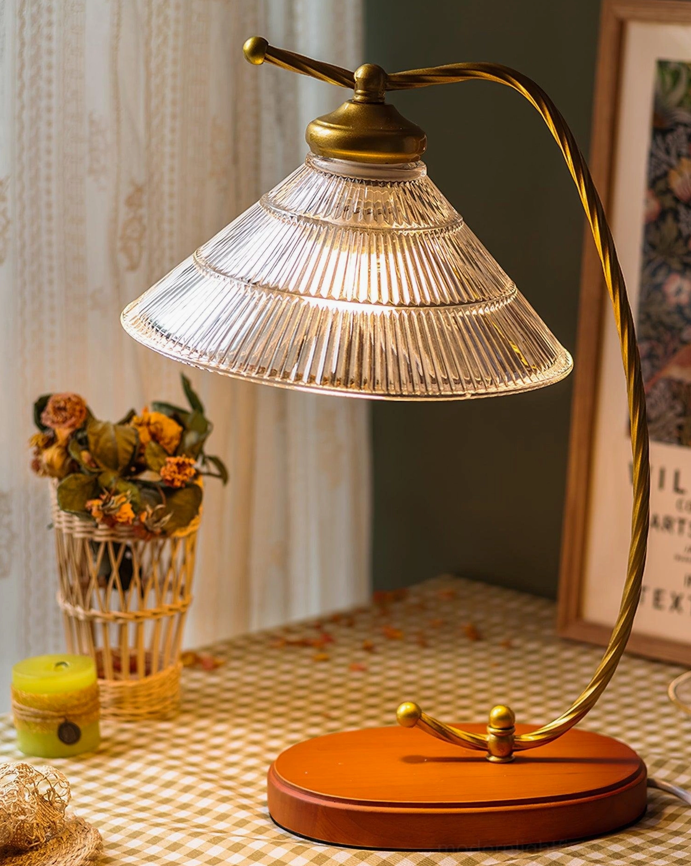 Vintage reading table lamp with twisted brass-gold arm and dried flower decor beside lace curtain, cozy side table arrangement