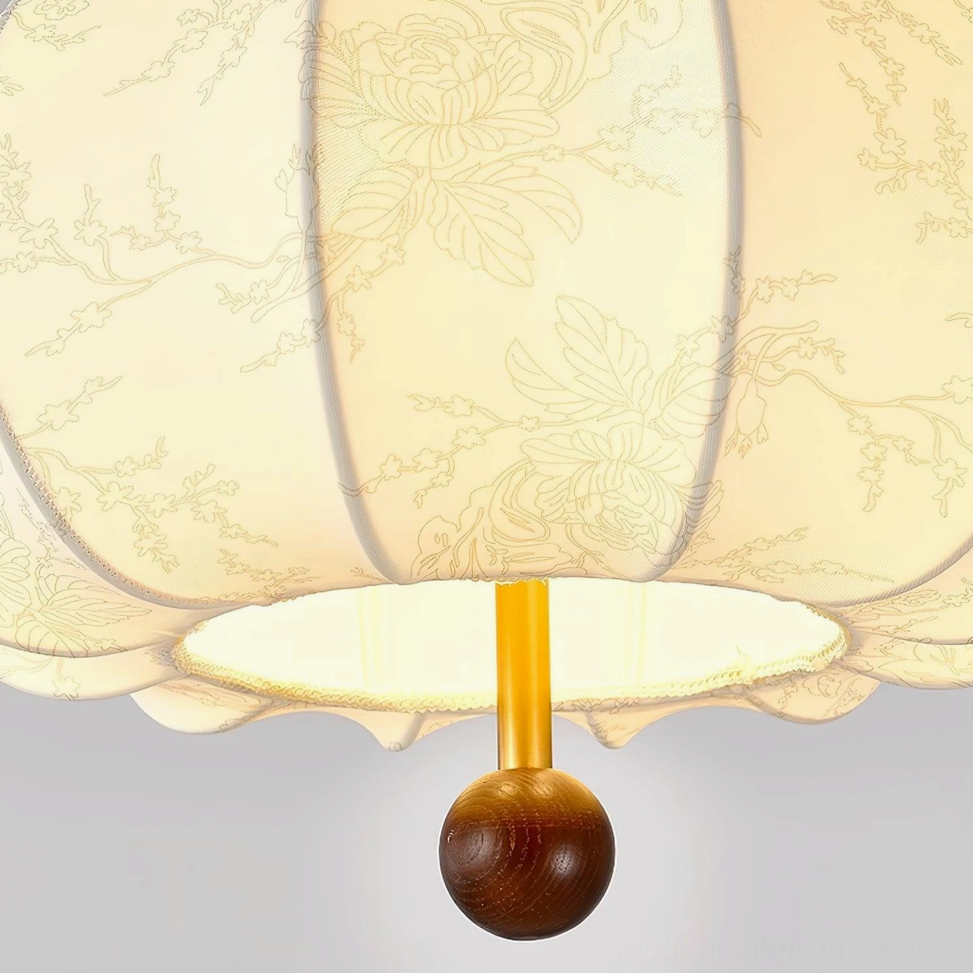 Vintage botanical pendant light showing shadow play and light diffusion through fabric shade