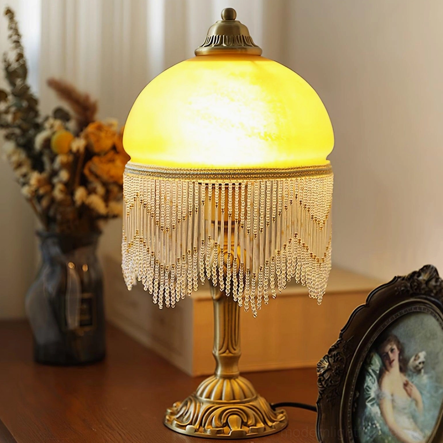 Vintage brass table lamp with tassel showing elegant glass shade and ornate metal base - home office lighting