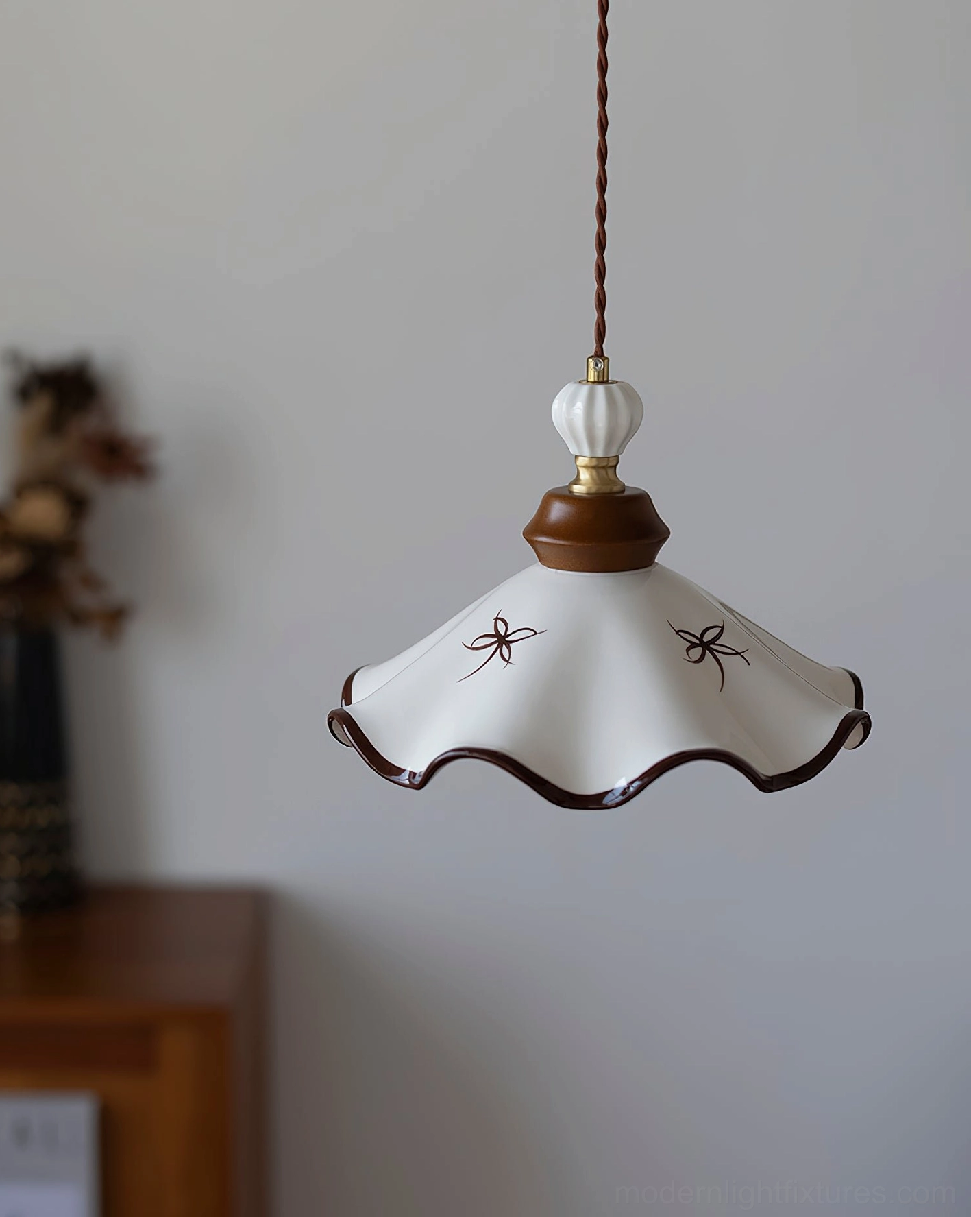 Vintage ceramic pendant light installed in dining area, showing soft diffused glow and scalloped shade design