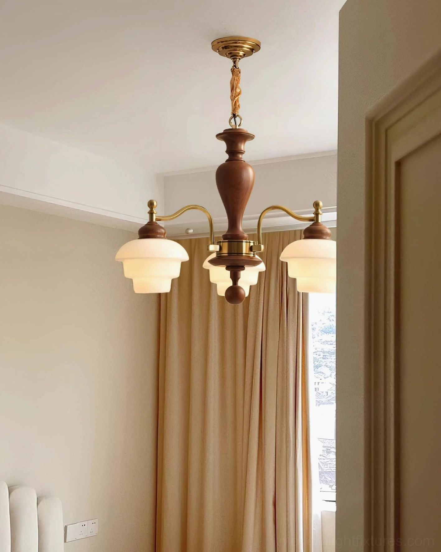 Vintage wood and metal chandelier detailed view showing frosted glass shades and metal arm construction