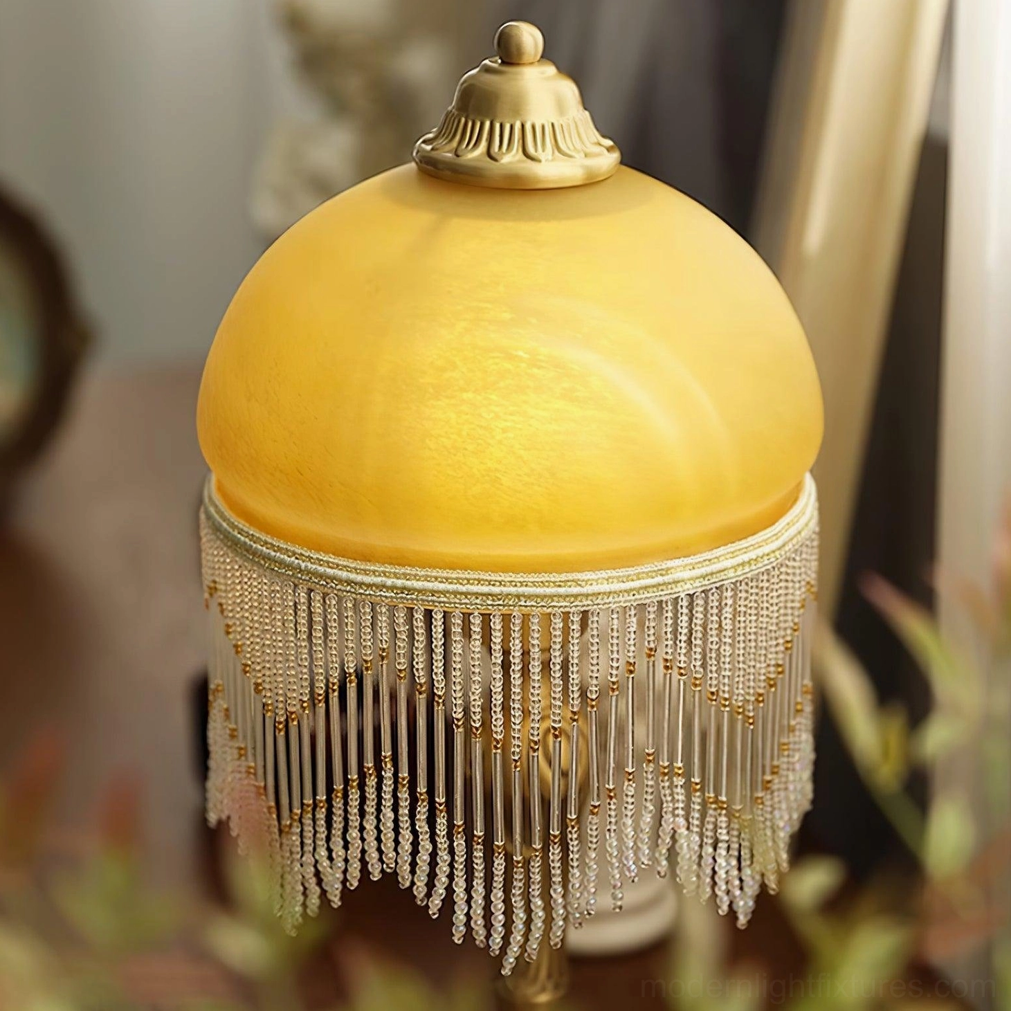 Vintage decorative brass table lamp with tassel and amber glass shade - classic European design style