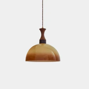 Vintage dome pendant light with gradient amber-brown glass shade, mid-century modern design, front view on white studio background