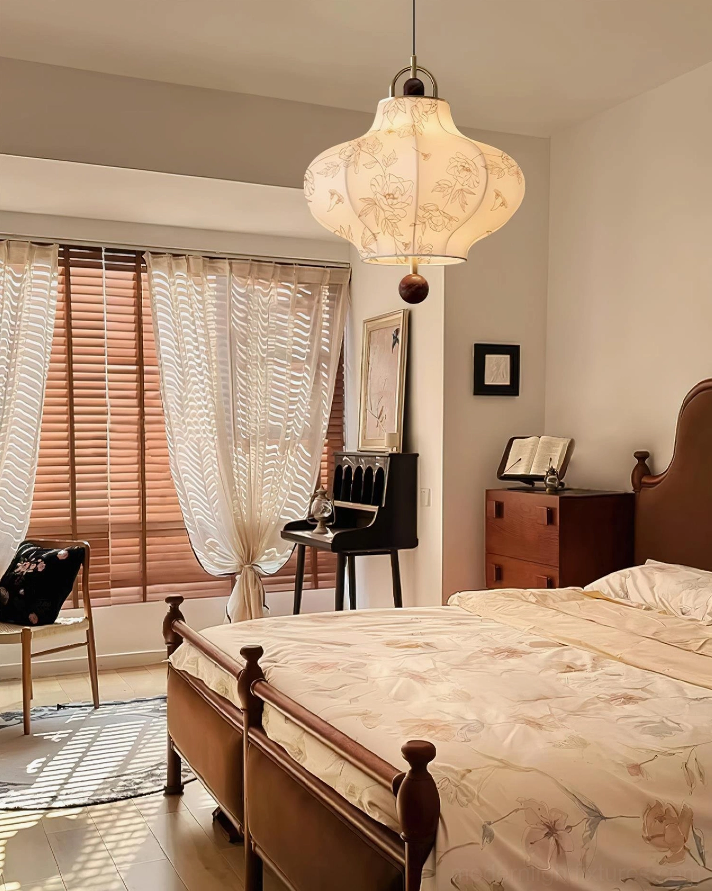 Vintage fabric pendant lamp creating warm ambient lighting in bedroom interior