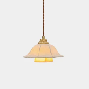 Vintage fabric pendant light with brass fixture and floral-embossed off-white shade, front studio view
