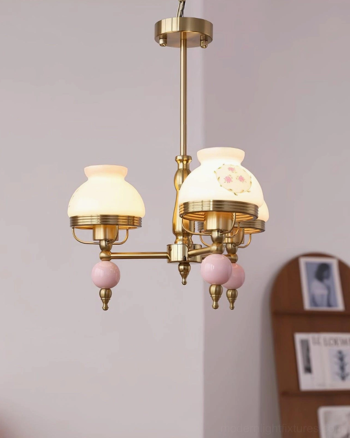 3-head retro pendant light fixture with decorative floral glass shades in studio photography