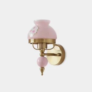 Retro floral wall sconce with pink frosted glass shade and brass gold hardware, front three-quarter view