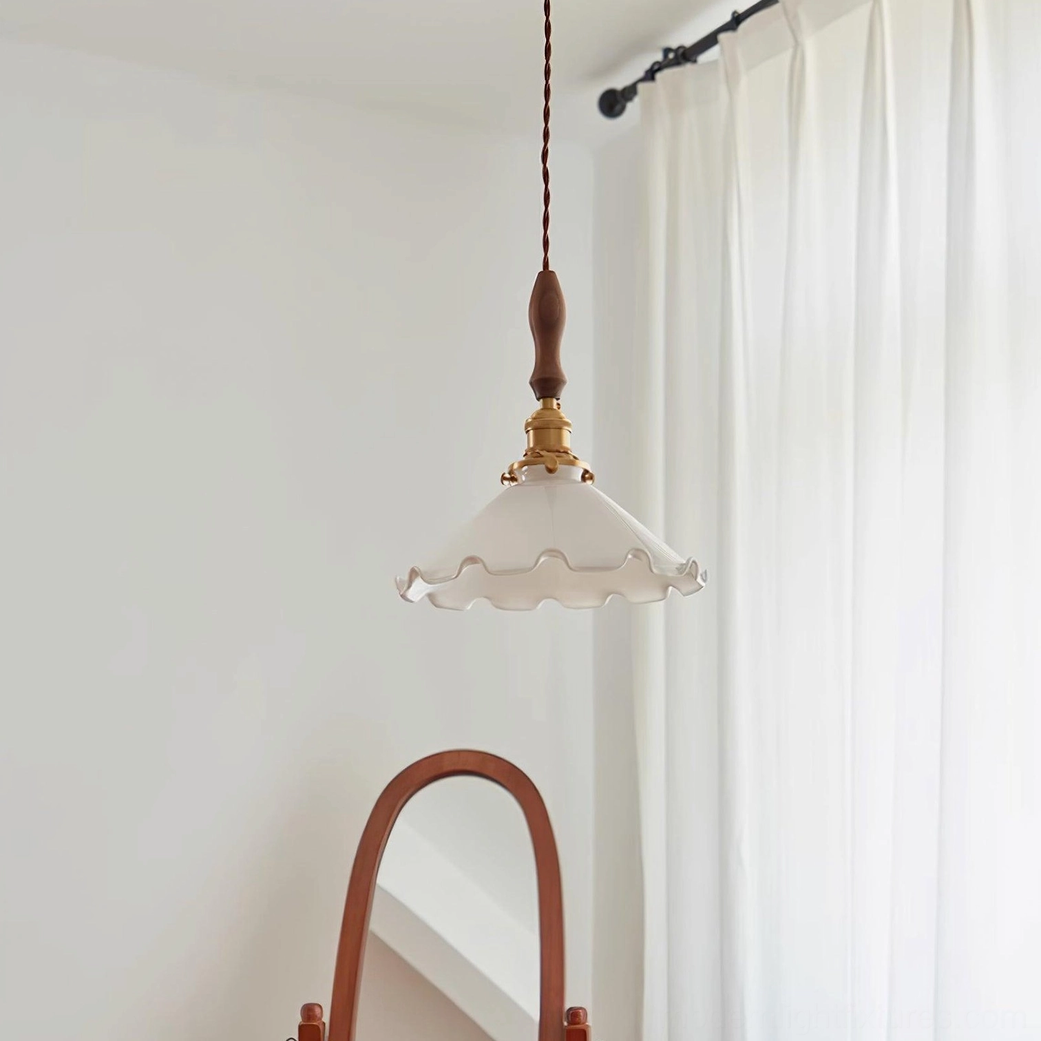 Vintage ruffled flower pendant fixture showing glass texture and brass hardware detail