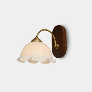 Vintage flower wall sconce with wave-edged milky glass shade and brass metal arm, front studio view with dark walnut wooden base, retro pastoral lighting design