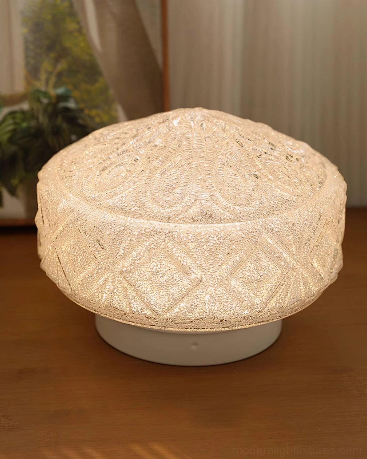 Vintage glass ceiling light fixture installed in home setting, demonstrating warm ambient lighting and artistic carved design