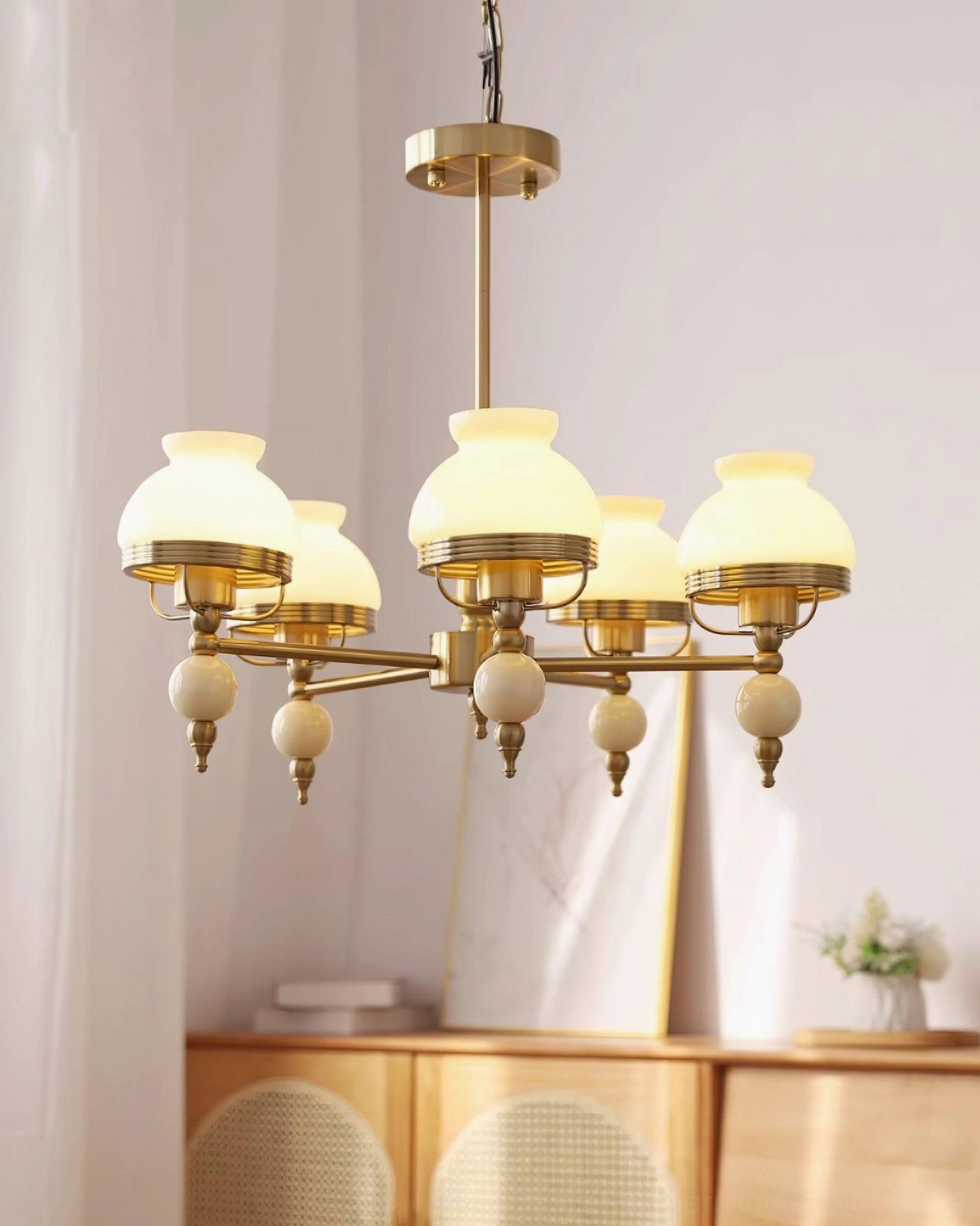 5-head vintage chandelier with solid milky white glass shades and white ceramic pendants on wooden furniture