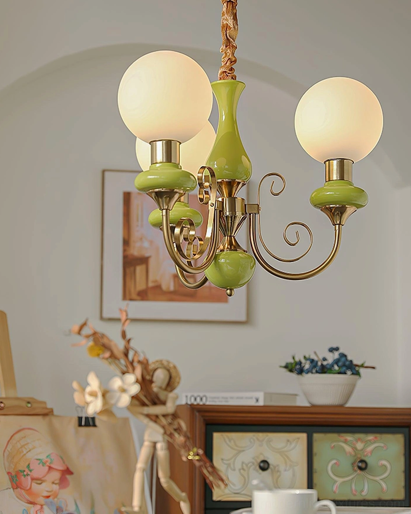 Vintage glass chandelier with illuminated frosted spheres and swirling gold arms