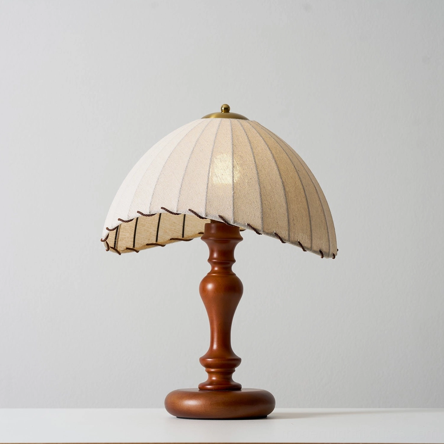 Vintage inspired table lamp with hand-stitched pleated linen shade and solid wood construction