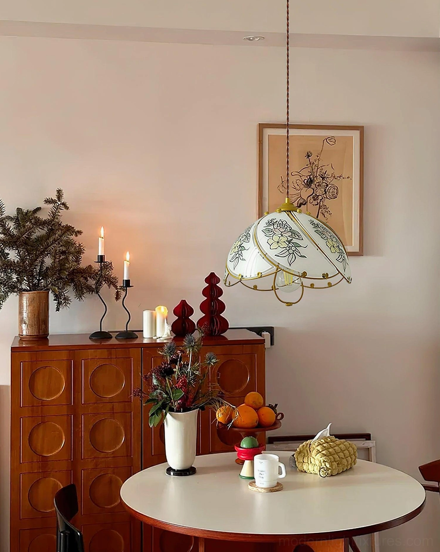 Vintage lily pendant fixture suspended over warm-toned dining area, creating intimate table lighting