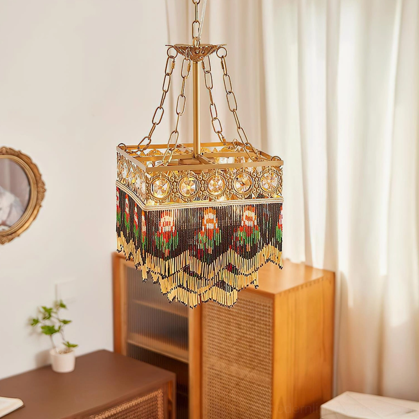 Vintage luxury pendant light with gold metal trim and ornate beaded fringe in home corner