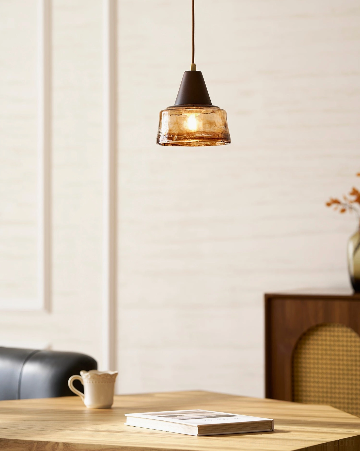 Vintage Murano pendant light showing brass support and hand-blown glass shade