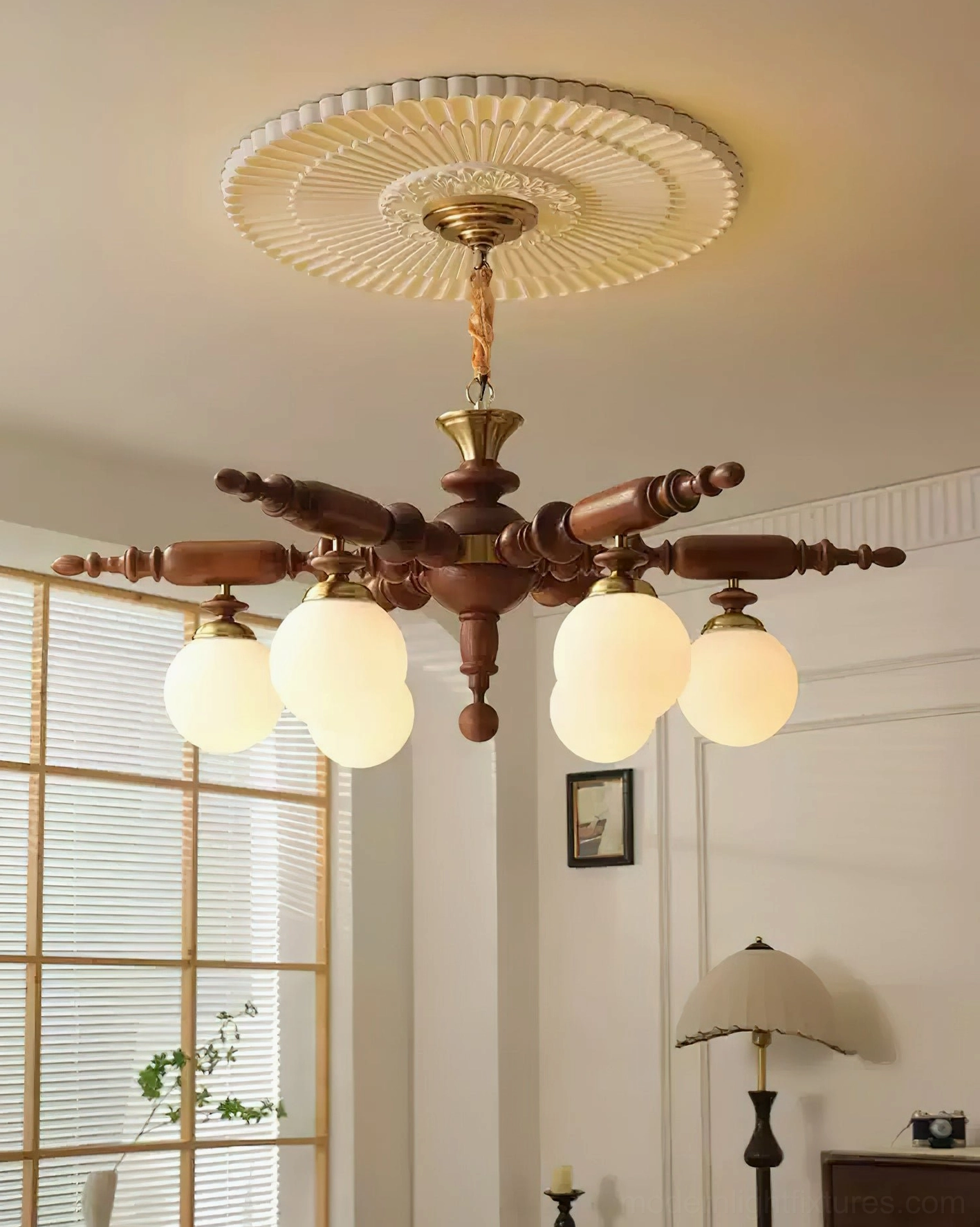 Vintage wooden chandelier with brass accents in retro living room setting