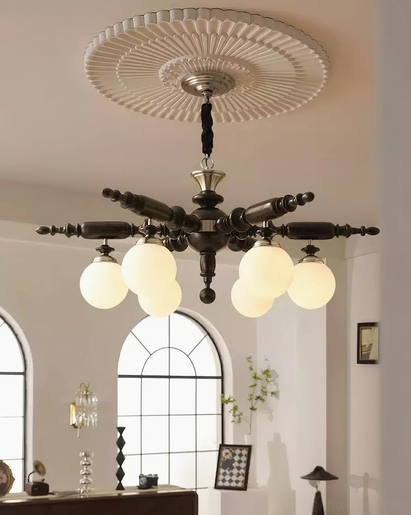 Dark finish Olina chandelier low-angle view with frosted glass ball lamps