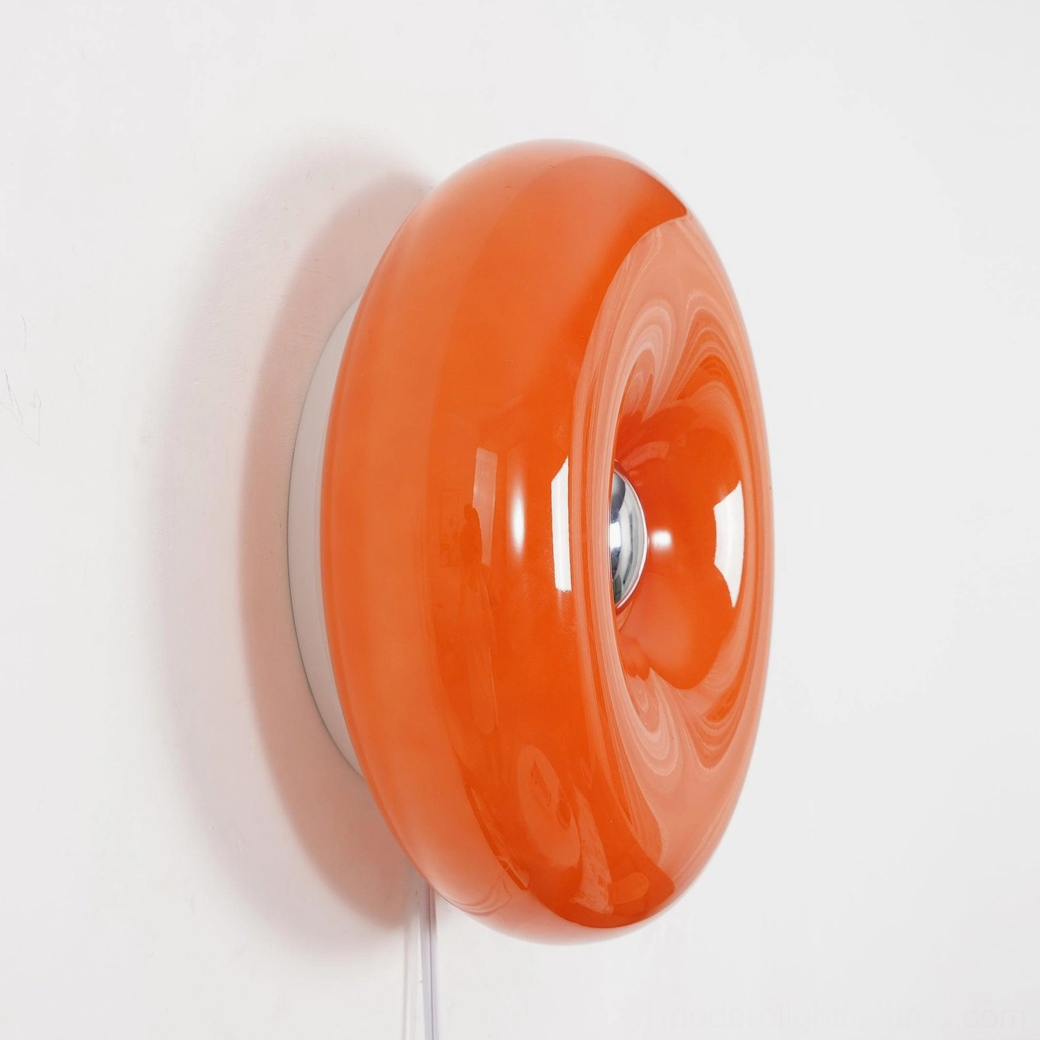 Vintage-style orange donut wall sconce perfect for mid-century modern and eclectic interior design
