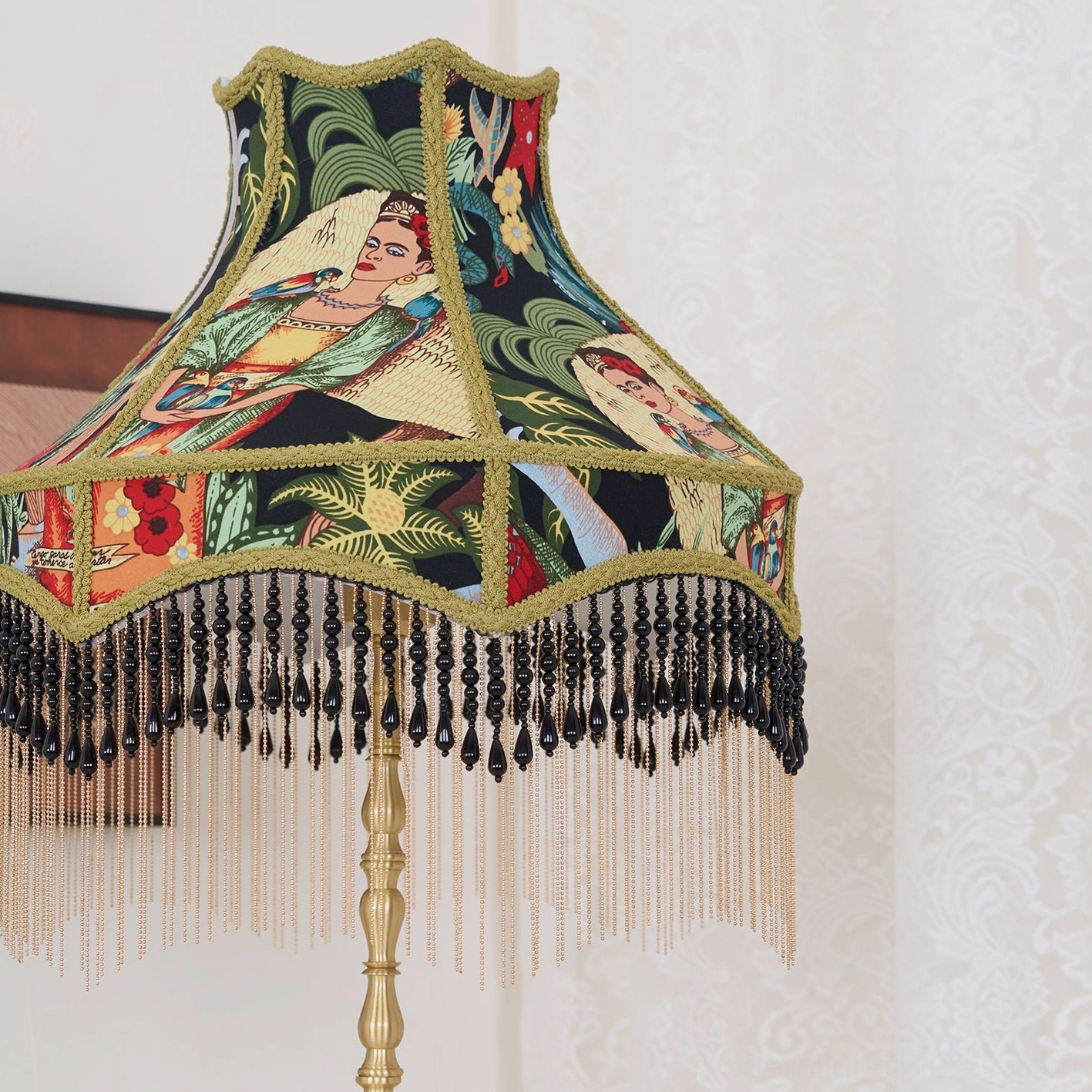 Vintage peony embroidered table lamp with decorative tassel fringe in warm home lighting