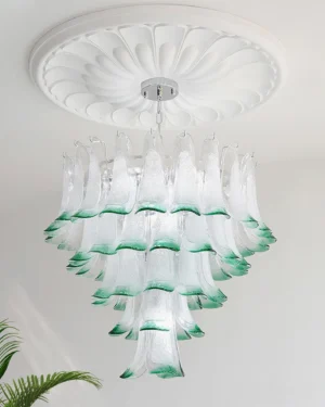Ombre white-to-green glass petal chandelier mounted on decorative ceiling medallion in residential interior