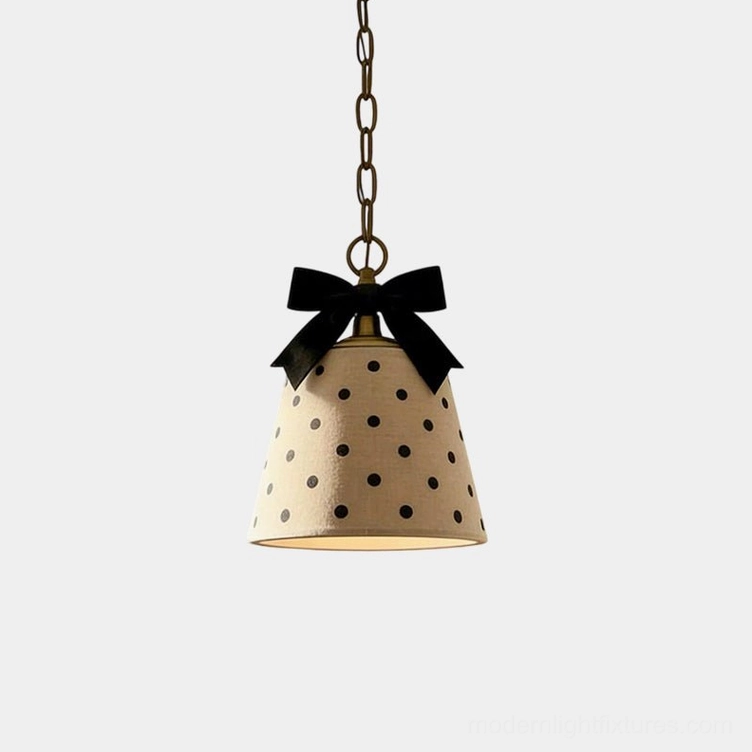 Vintage polka dot pendant light with black bow detail, beige fabric shade with black polka dots, metal suspension chain, Parisian farmhouse style