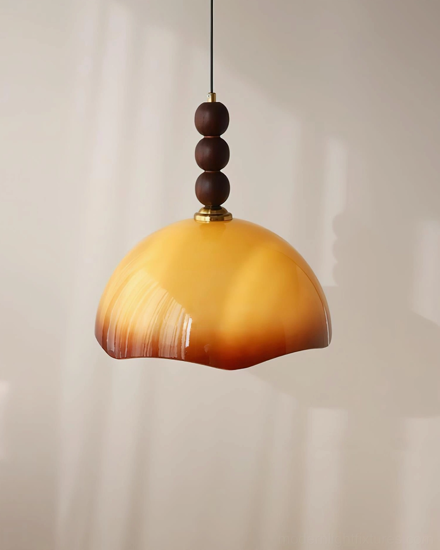 Vintage-style rippled glass pendant lamp with dark wood finial in transitional interior design setting