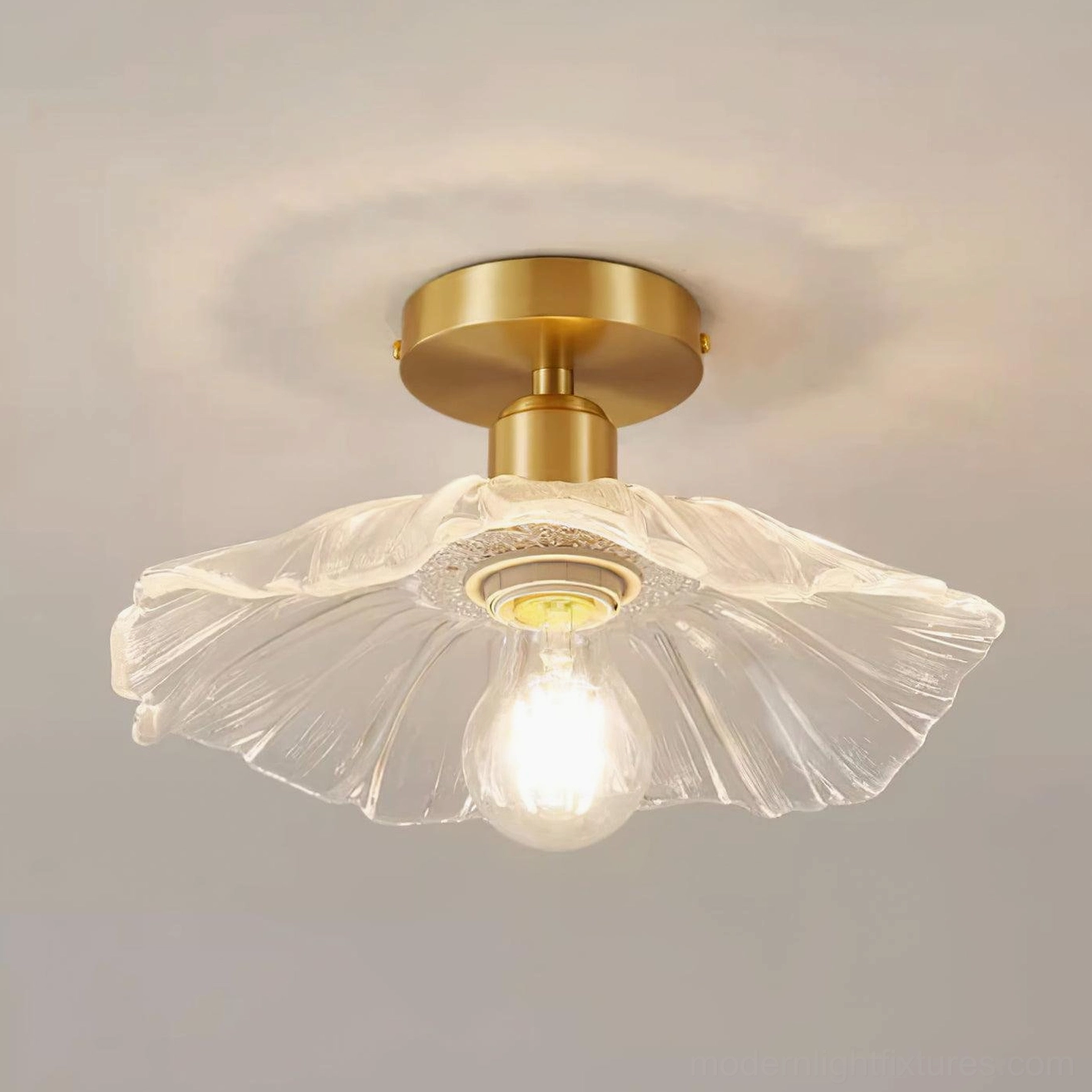 Vintage-inspired ruffled glass semi-flush ceiling light fixture with clear textured shade and polished brass finish