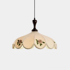 Vintage scalloped floral pendant light with cream fabric shade, embroidered rose motifs, pearl beaded trim, and dark wood ceiling mount - studio view