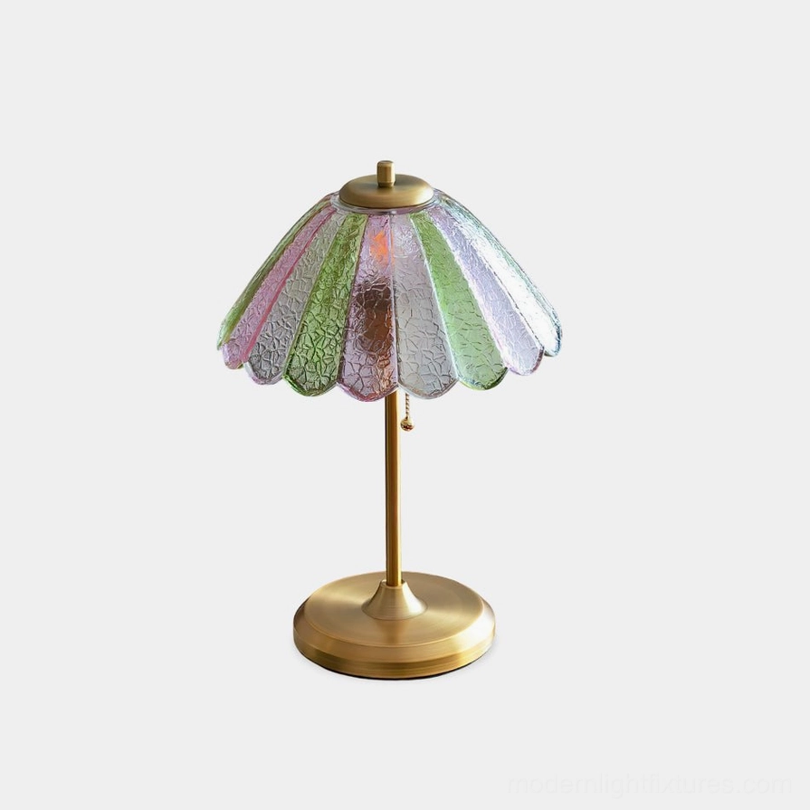 Vintage scalloped glass table lamp with brass base and green and rose gradient shade frontal view