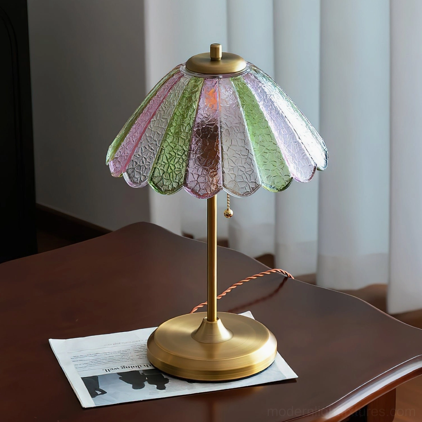 Vintage scalloped table lamp with multi-color gradient glass shade and brass base displayed on home side table