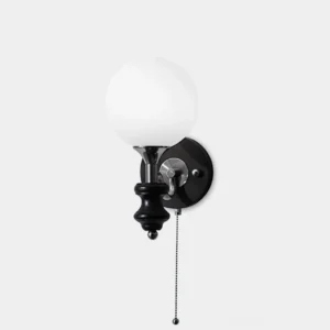 Vintage spherical wall sconce with frosted white glass globe and matte black metal base, front studio view