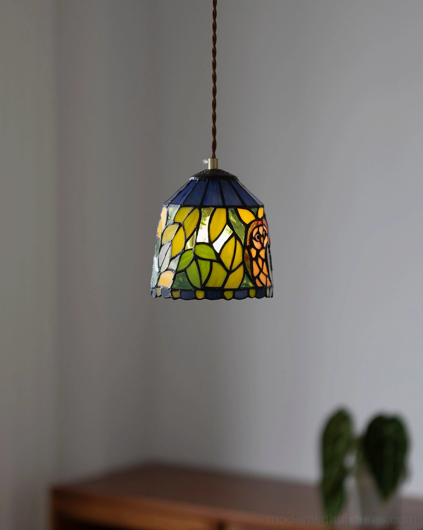 Vintage stained glass pendant lamp with warm color palette and artistic nostalgic design elements
