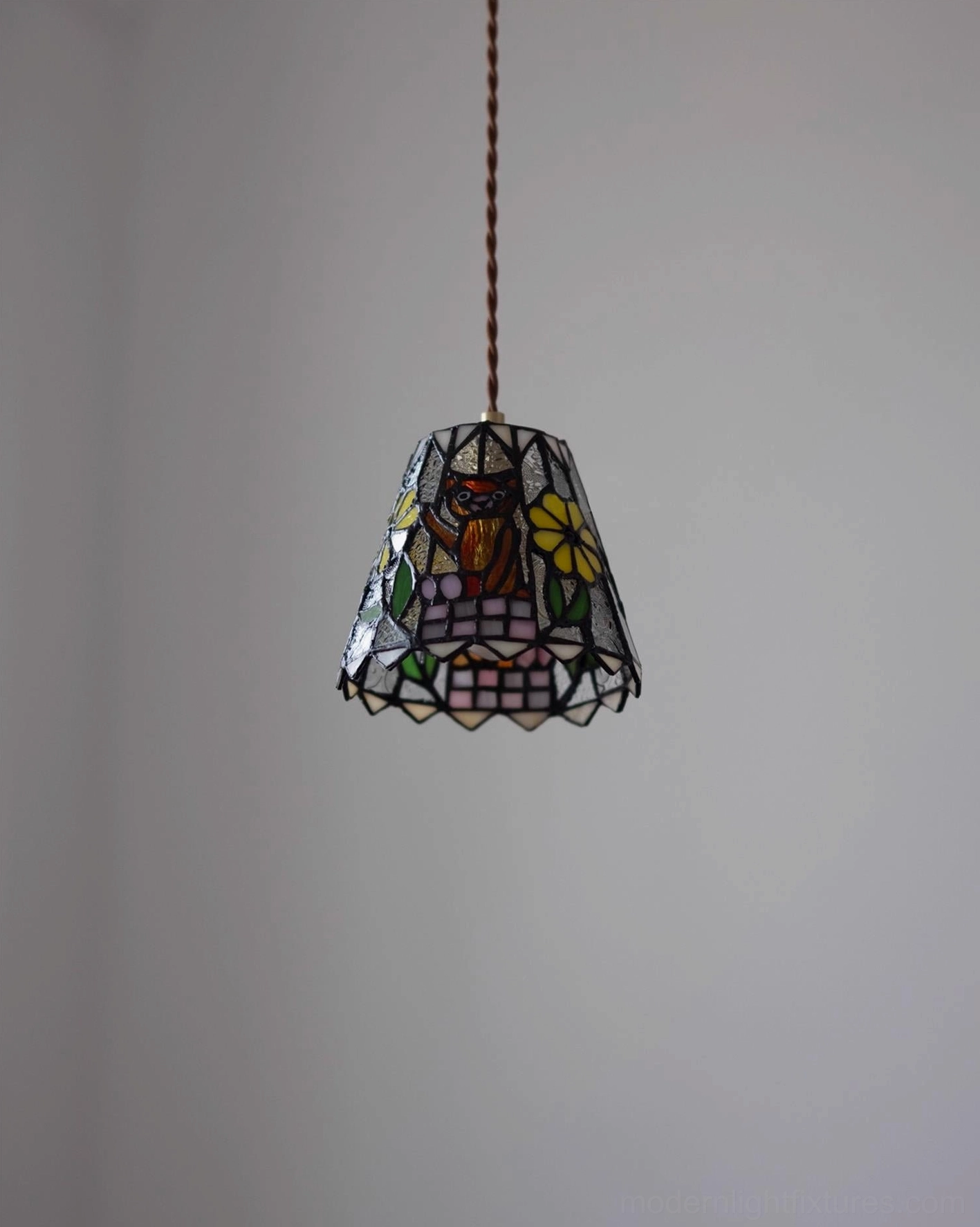 Handcrafted vintage stained glass pendant light with intricate floral and fauna designs