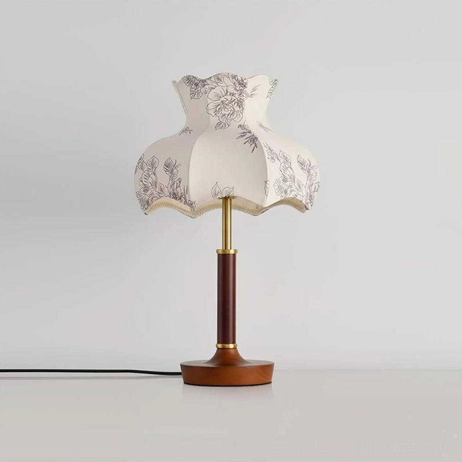 Vintage table lamp with scalloped floral print shade, walnut wood base and metal accents close-up detail